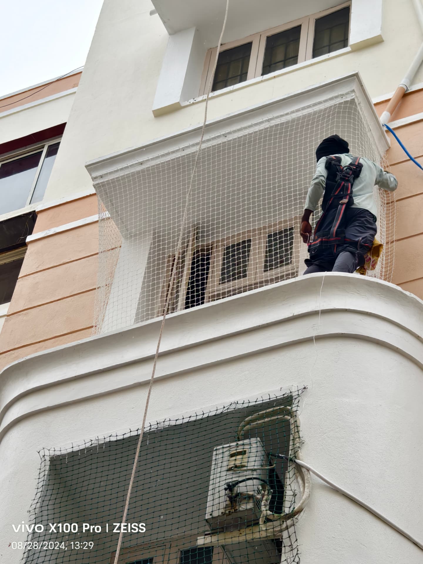 Pigeon-net installation at an exterior window opening — general real YPL pigeon-net work in Chennai, property not identified