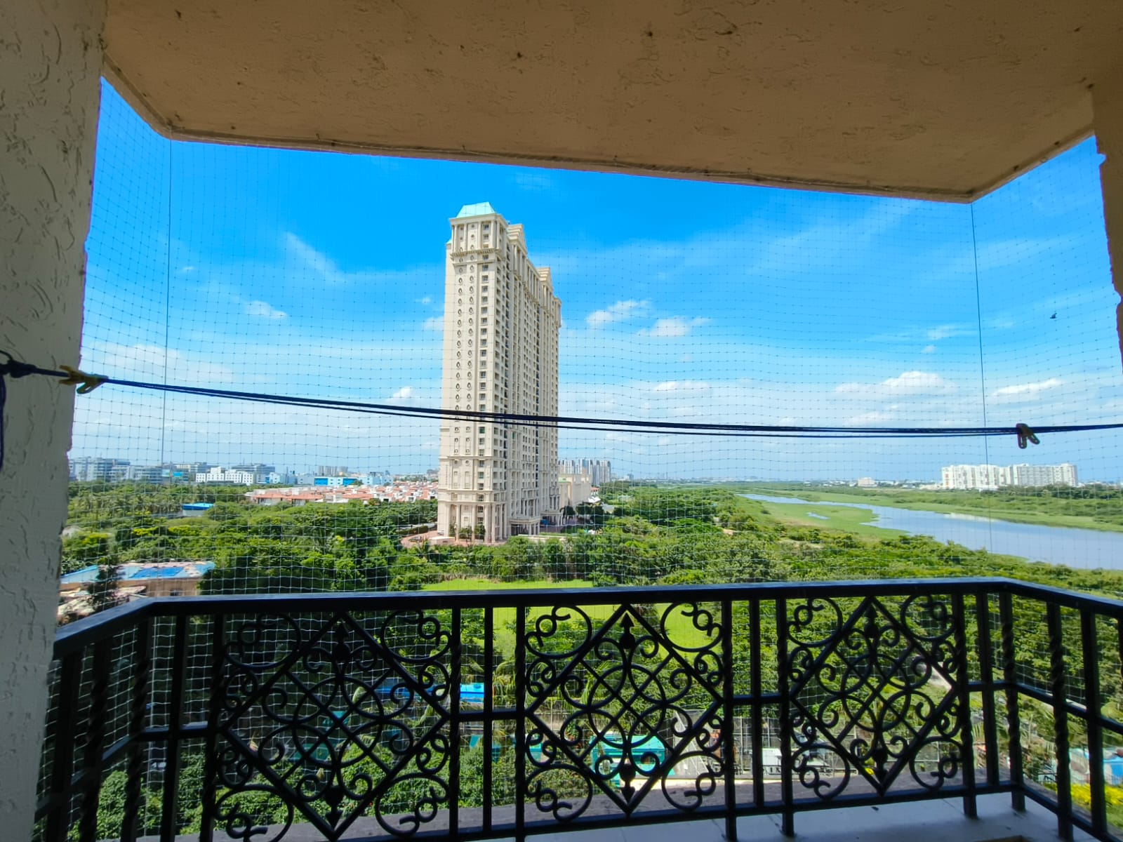Balcony safety net with an open outdoor view. Property not identified.