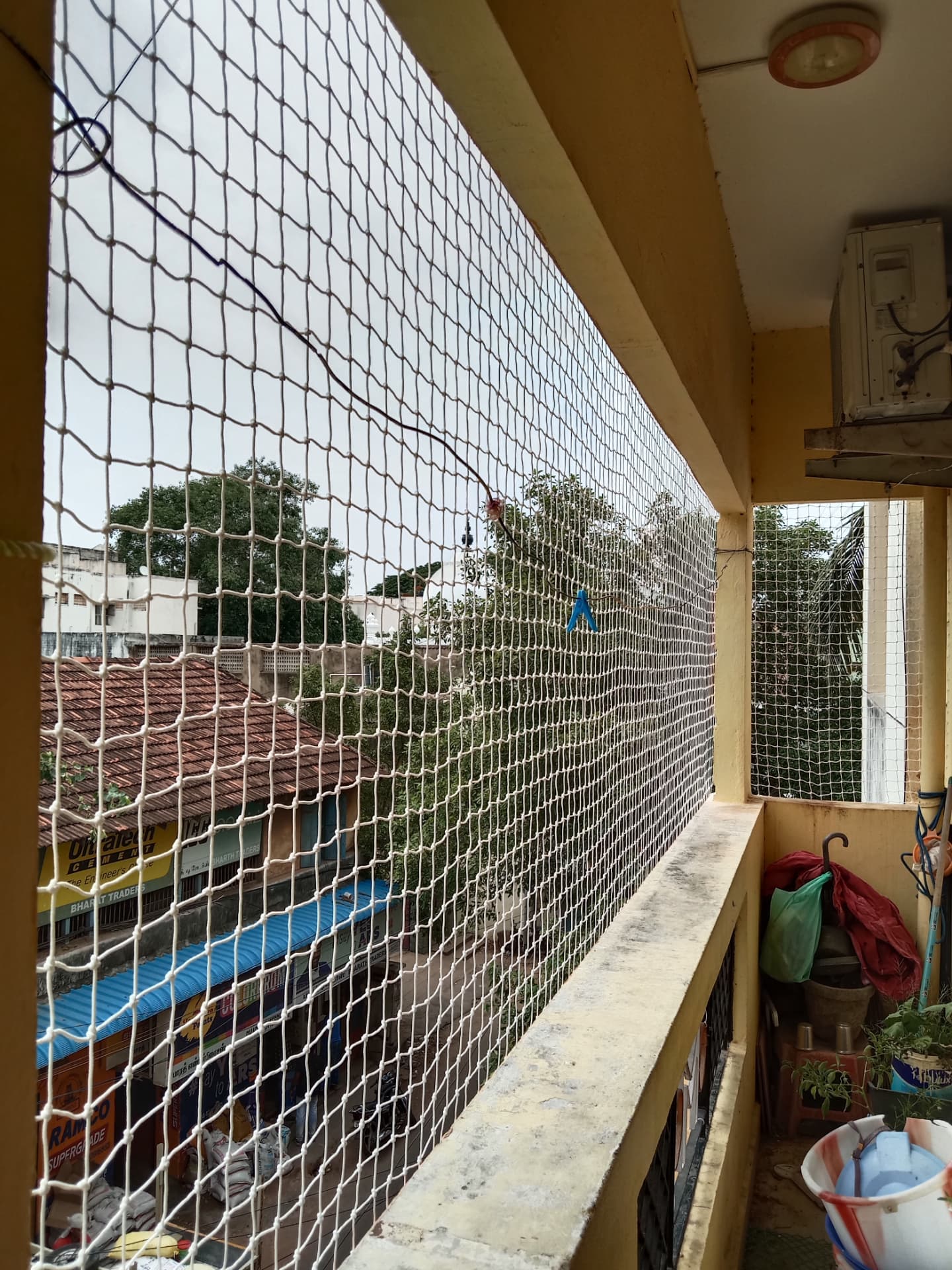 General real YPL pigeon-net balcony example in Chennai; exact property not identified