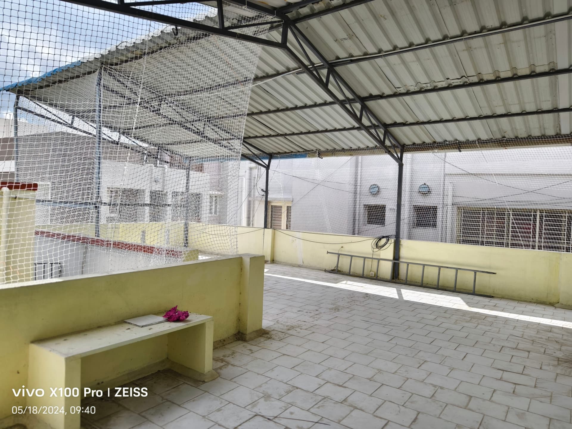 Pigeon nets along the sides of a covered terrace — general real YPL pigeon-net work in Chennai, property not identified