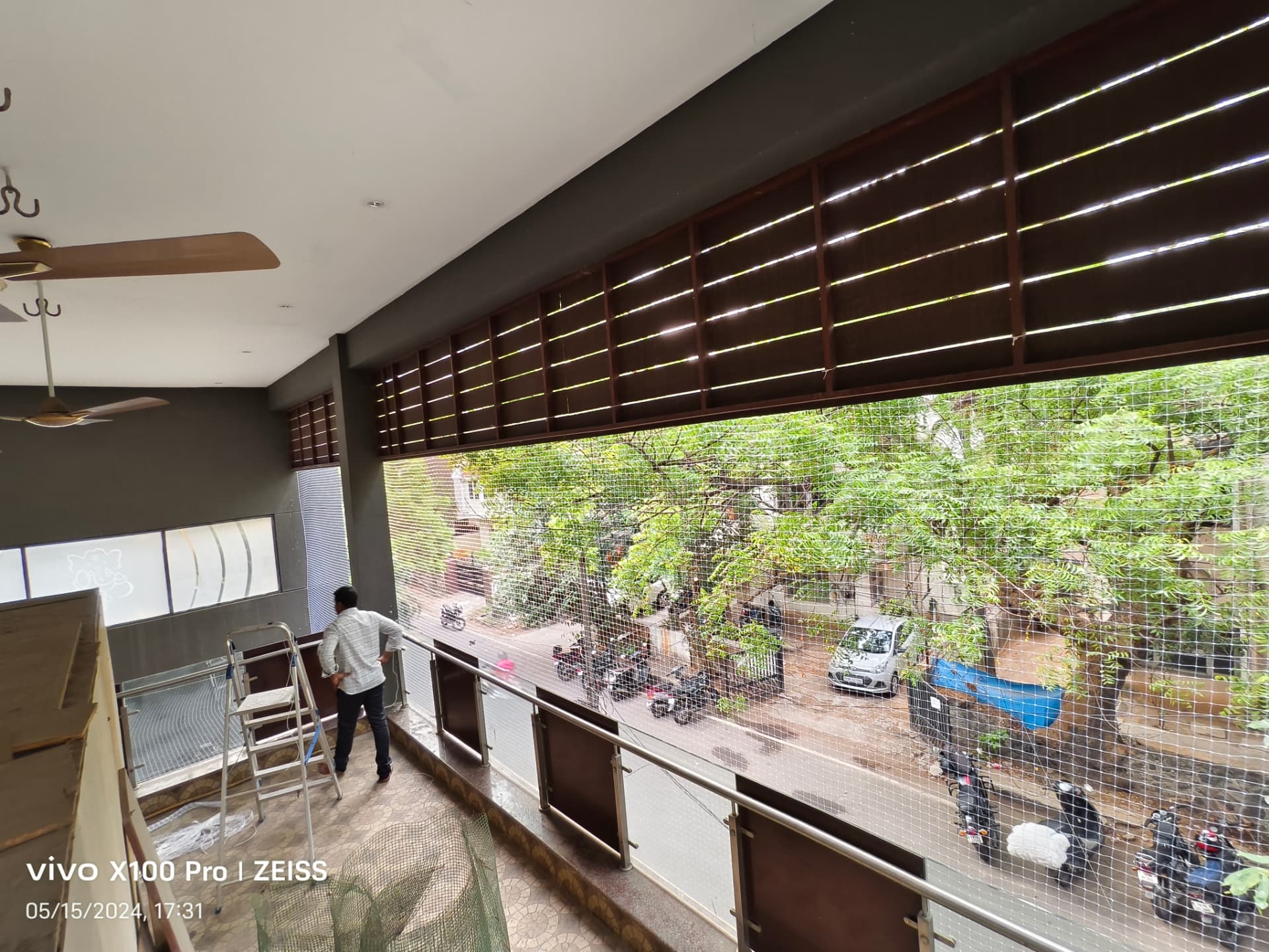 Pigeon net across a wide covered opening — general real YPL pigeon-net work in Chennai, property not identified