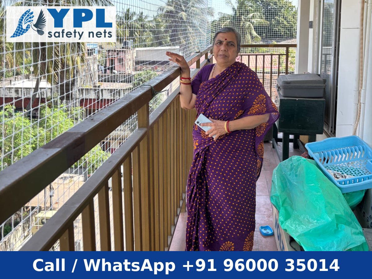 White balcony safety net fitted across an apartment balcony, Chennai – YPL Safety Nets, call +91 96000 35014