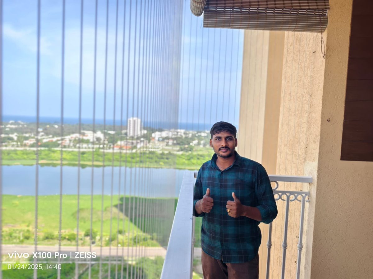 Garware SS316 invisible grill fitted on a high-rise apartment balcony with lake and sea view, Chennai – YPL Safety Nets